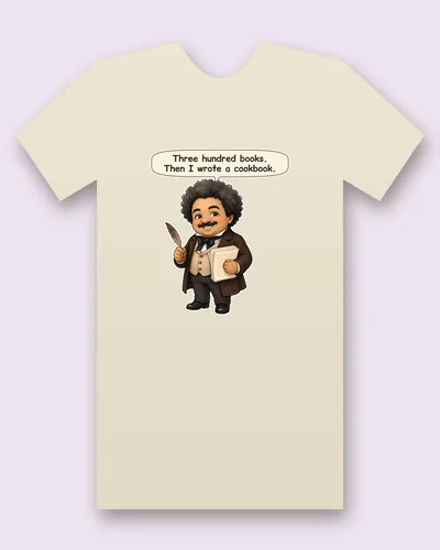 Alexandre Dumas tee mockup: Alexandre Dumas with a cloud of dark curls and a moustache, a brown frock coat, a cream waistcoat and a black bow tie, holding a feather quill and a stack of handwritten pages, saying “Three hundred books. Then I wrote a cookbook.”