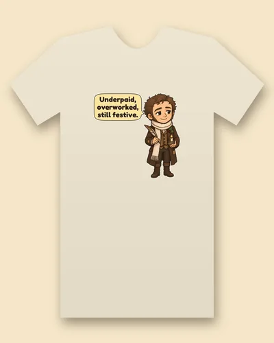 Bob Cratchit tee mockup: Bob Cratchit with curly brown hair and a short beard, in a patched brown coat and a long cream knitted scarf with a sprig of holly, holding a feather quill and a small candle, saying “Underpaid, overworked, still festive.”