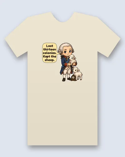 British King tee mockup: A chibi king in a powdered white wig with a black hair bow, a blue coat with red collar and cuffs and gold trim, and a blue sash with a star, cuddling a lamb, with a second lamb and a small mantel clock at his feet, and a speech bubble beside him, saying “Lost thirteen colonies. Kept the sheep.”