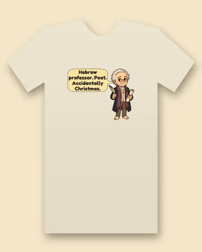 Clement Moore tee mockup: An older man with white hair and round glasses in a dark coat and plum scarf, holding a quill and a scroll, with a speech bubble beside him, saying “Hebrew professor. Poet. Accidentally Christmas.”