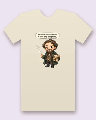 Charles Dickens tee mockup: a writer with curly brown hair, a full beard, a bow tie, a patterned waistcoat with a watch chain and a green frock coat, holding a feather quill and a stack of books, saying “Paid by the chapter. Very long chapters.”