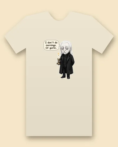 Dracula tee mockup: Dracula with long white hair and a long black coat, holding a lit candle, saying “I don't do mornings. Or garlic.”