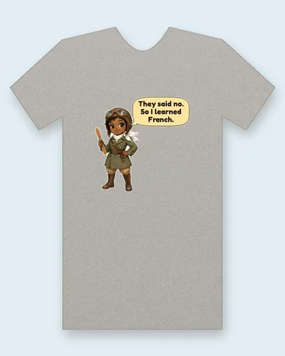 First Black Woman Pilot tee mockup: The first Black woman pilot in a brown leather flying cap with goggles, a white scarf and an olive flying coat, holding a small wooden propeller, saying “They said no. So I learned French.”
