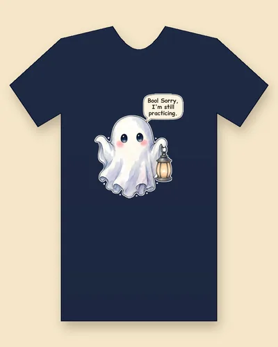 Little Lantern Ghost tee mockup: a little sheet ghost with big dark eyes, rosy cheeks and pale blue and lavender shading, holding a glowing lantern, saying “Boo! Sorry, I'm still practicing.”