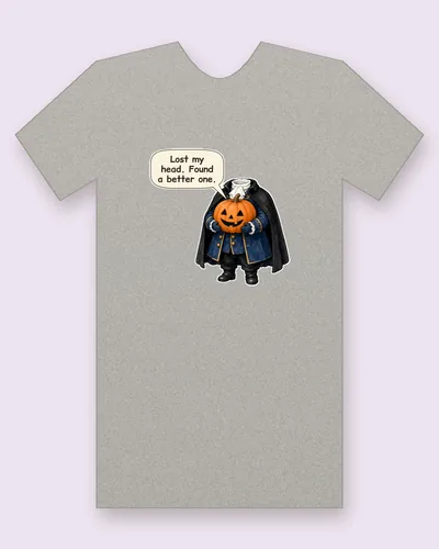 Headless Rider tee mockup: a headless rider in a sweeping black cape and a navy coat with gold buttons and lace cuffs, proudly holding a grinning jack-o'-lantern where his head should be, saying “Lost my head. Found a better one.”