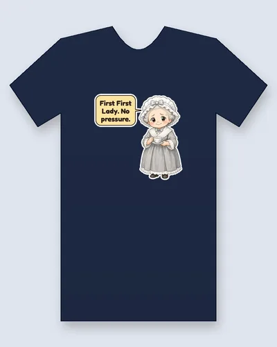 Martha Washington tee mockup: Martha Washington with grey curls under a ruffled white bonnet with a bow, in a grey lace-trimmed gown, holding a teacup and saucer, saying “First First Lady. No pressure.”