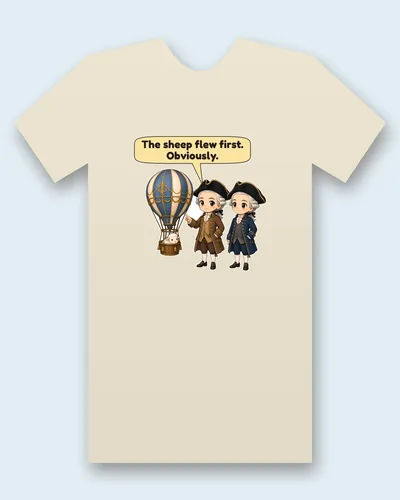 Montgolfier Brothers tee mockup: The two Montgolfier brothers in tricorn hats and frock coats, one brown and one navy, beside a blue-and-cream hot-air balloon with a fluffy sheep in the basket, saying “The sheep flew first. Obviously.”