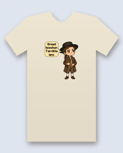 Nathan Hale tee mockup: A young man in a wide black hat and brown coat and waistcoat, holding a book and a pointer stick, with a speech bubble beside him, saying “Great teacher. Terrible spy.”