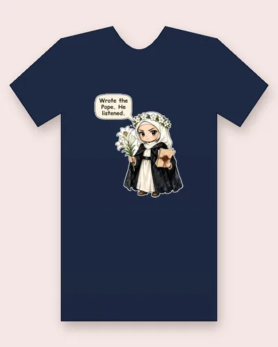 Saint Catherine of Siena tee mockup: a young woman in a white veil with a crown of white flowers and a black cloak over a white habit, holding white lilies and a bundle of sealed letters, saying “Wrote the Pope. He listened.”