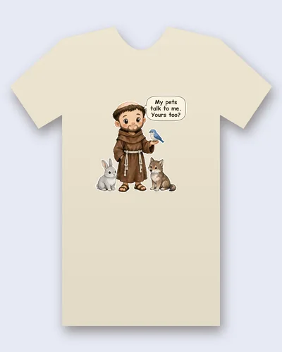 Saint Francis of Assisi tee mockup: Saint Francis of Assisi in a brown hooded habit with a white rope belt and sandals, a little bluebird perched on his hand, with a bunny and a wolf pup at his feet, saying “My pets talk to me. Yours too?”